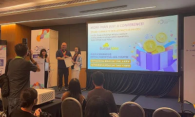 RMAICT CEO receiving award on stage during conference session hosted by ButterIdea