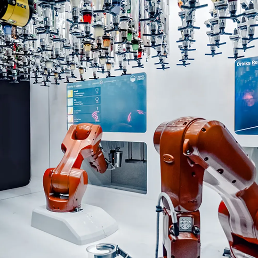 Industrial robotic arms operating on an automated manufacturing line