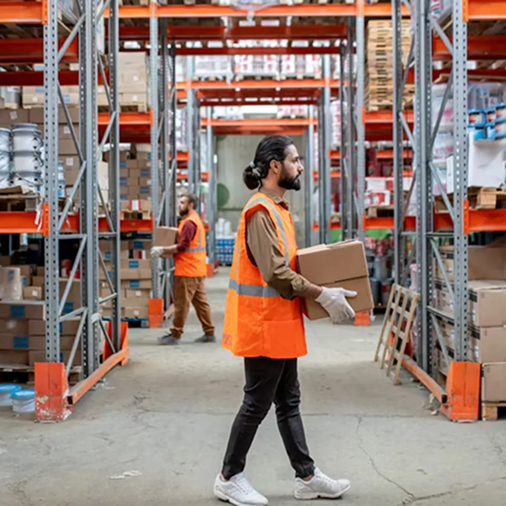 Warehouse employees inspecting inventory in a large distribution facility